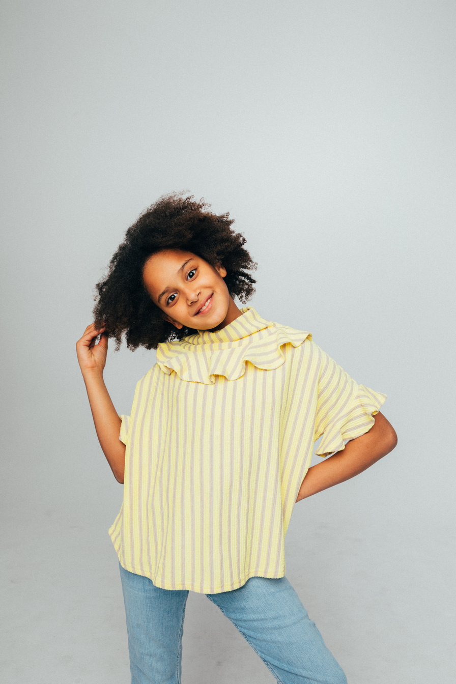 Girl in Yellow and White Striped Dress